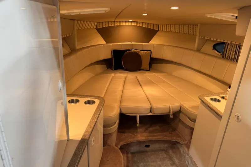 Slide: The Image of Interior of 2001 Formula 330 Sun Sport boat with beige seating and compact design. - 14