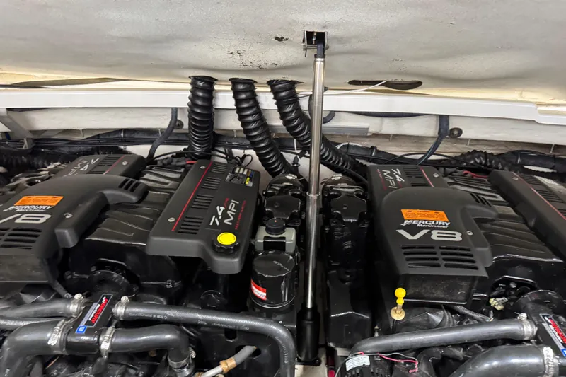 Slide: The Image of Twin Mercury V8 engines in a 2001 Formula 330 Sun Sport boat. - 15