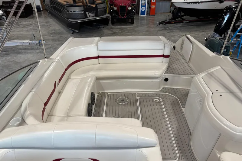 Slide: The Image of 2001 Formula 330 Sun Sport boat interior with white seating and red accents. - 6