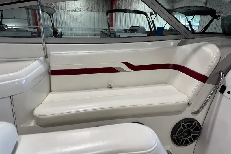 Slide: The Image of 2001 Formula 330 Sun Sport boat interior with white seating and red accent stripe. - 7
