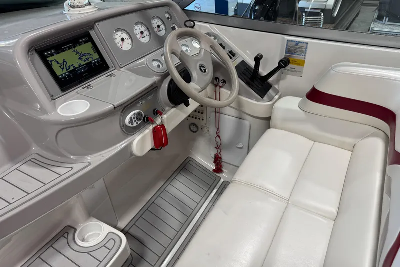 Slide: The Image of Cockpit of 2001 Formula 330 Sun Sport boat with steering wheel and navigation system. - 8