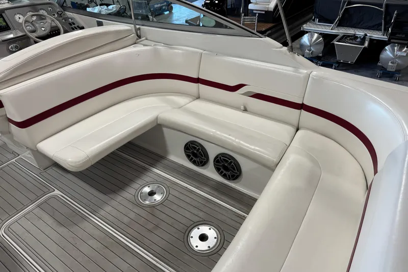 Slide: The Image of 2001 Formula 330 Sun Sport boat interior with white seating and red accents. - 9