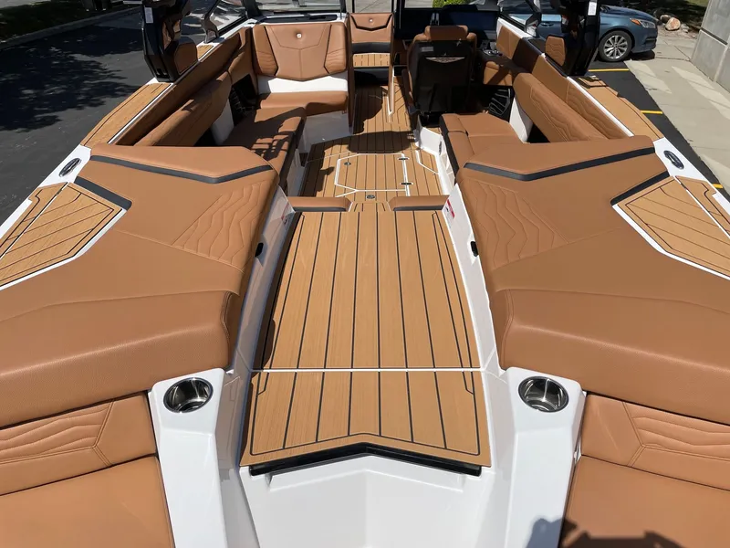 Slide: The Image of Interior of 2026 Nautique G25 with luxurious brown seating. - 4