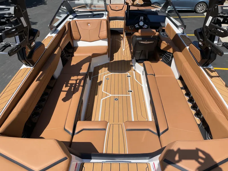 Slide: The Image of Interior of a 2026 Nautique G25 boat with luxurious leather seating. - 5