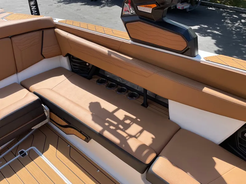 Slide: The Image of Interior of 2026 Nautique G25 with brown leather seating. - 9