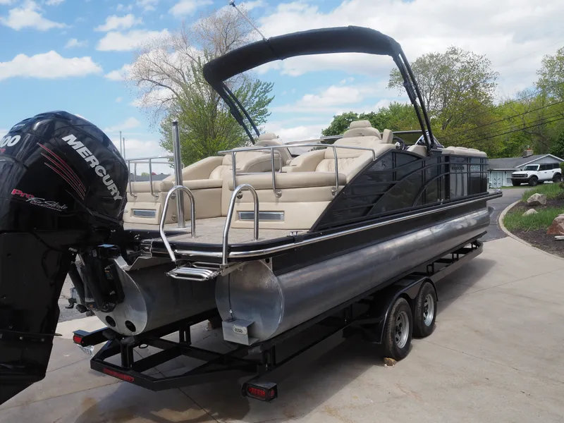 Slide: The Image of 2015 Bennington 2572 RCW pontoon boat with Mercury engine on trailer. - 6