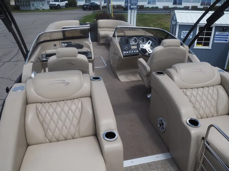 Slide: The Image of Interior of a 2015 Bennington 2572 RCW pontoon boat with luxurious seating. - 8