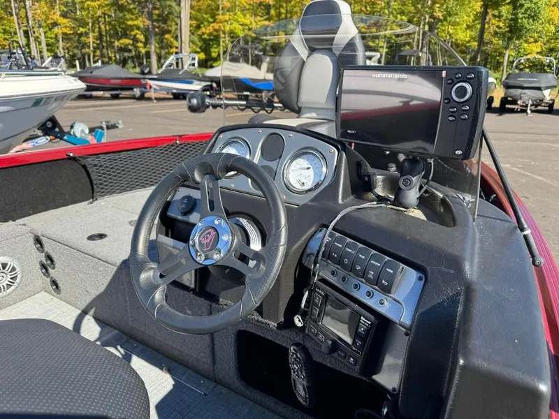 Slide: The Image of Interior view of 2023 Alumacraft Competitor 165 CS with steering console. - 13
