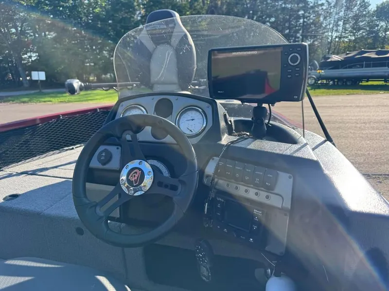 Slide: The Image of Dashboard of 2023 Alumacraft Competitor 165 CS with steering wheel and electronics. - 14