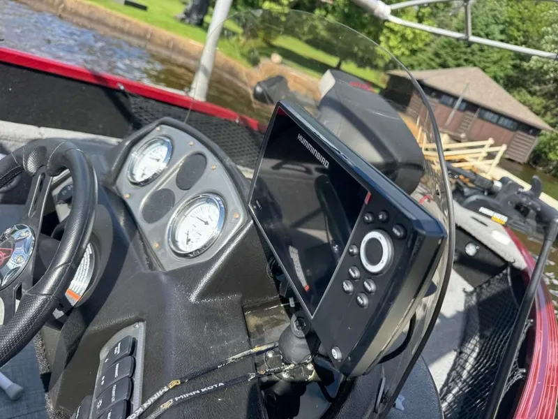 Slide: The Image of 2023 Alumacraft Competitor 165 CS boat dashboard with Humminbird fish finder. - 15