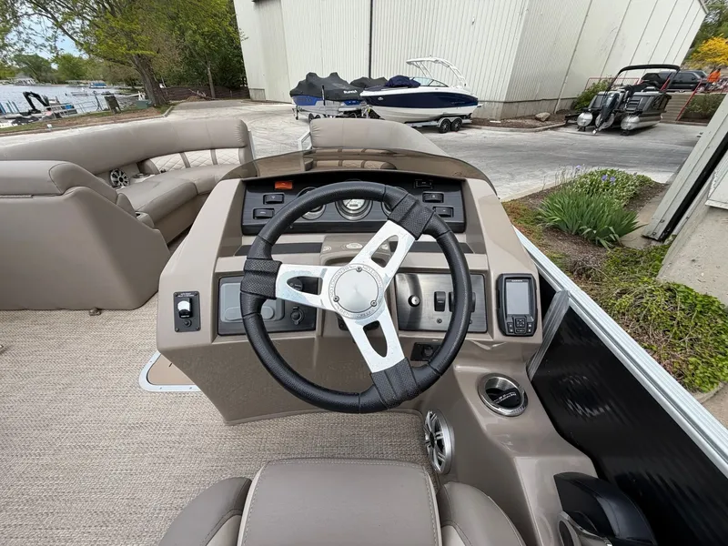 Slide: The Image of Interior view of 2019 Bennington 23SX helm with steering wheel. - 12