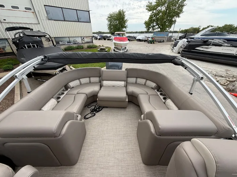Slide: The Image of Interior of a 2019 Bennington 23SX pontoon boat with beige seating. - 8