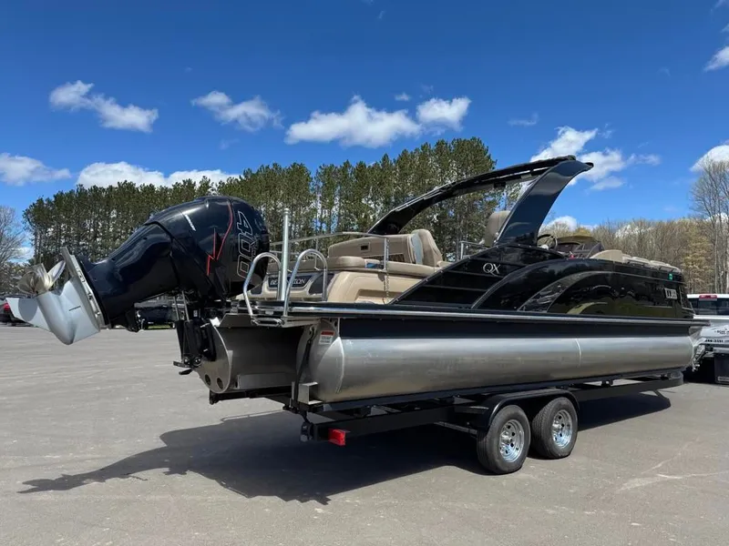 Slide: The Image of 2021 Bennington 25QXSBA ESP TRI pontoon boat on trailer. - 4