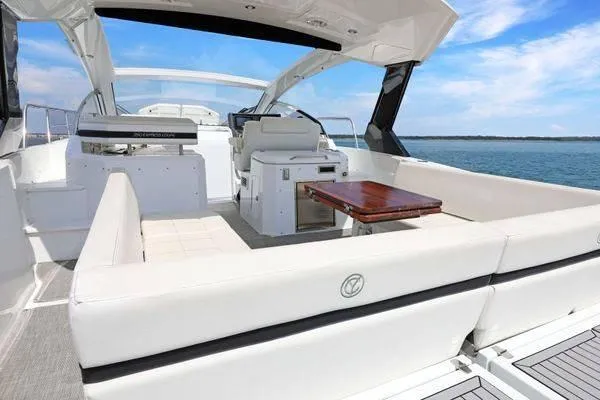 Slide: The Image of 2018 Cruisers Yachts 390 Express Coupe with spacious seating and ocean view. - 14