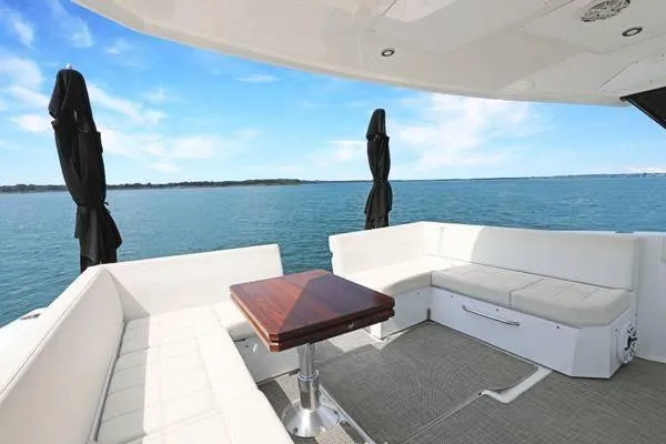 Slide: The Image of Luxurious 2018 Cruisers Yachts 390 Express Coupe with elegant seating and ocean view. - 22