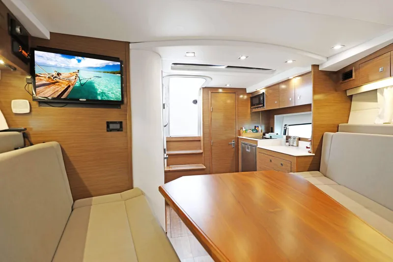 Slide: The Image of Luxurious interior of 2018 Cruisers Yachts 390 Express Coupe with modern amenities and wood finishes. - 33