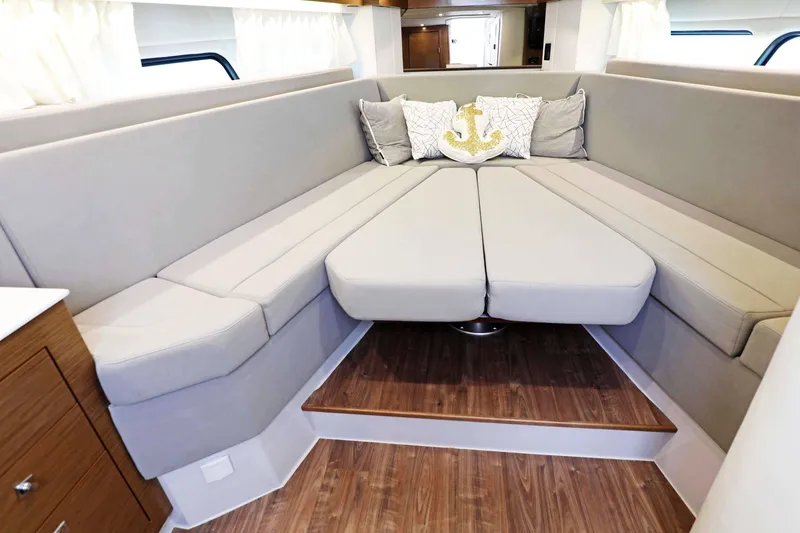 Slide: The Image of Luxurious interior of 2018 Cruisers Yachts 390 Express Coupe with elegant seating and nautical decor. - 38