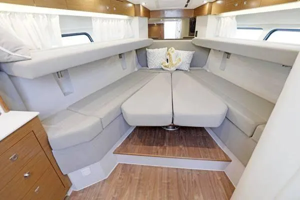 Slide: The Image of Interior of 2018 Cruisers Yachts 390 Express Coupe with elegant seating and wooden flooring. - 39