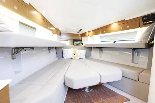 Slide: The Image of 2018 Cruisers Yachts 390 Express Coupe interior with modern seating and elegant design. - 40
