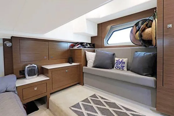 Slide: The Image of Interior of 2018 Cruisers Yachts 390 Express Coupe with modern seating and storage. - 42