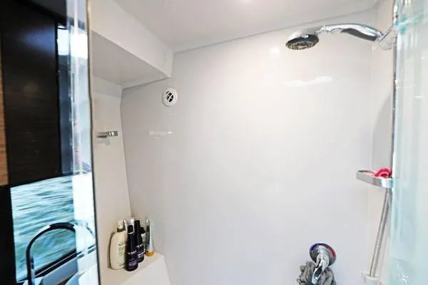 Slide: The Image of Shower area in 2018 Cruisers Yachts 390 Express Coupe, featuring modern fixtures and toiletries. - 45