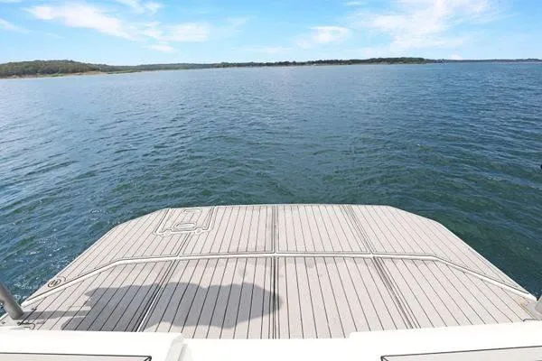 Slide: The Image of 2018 Cruisers Yachts 390 Express Coupe swim platform overlooking serene water. - 46