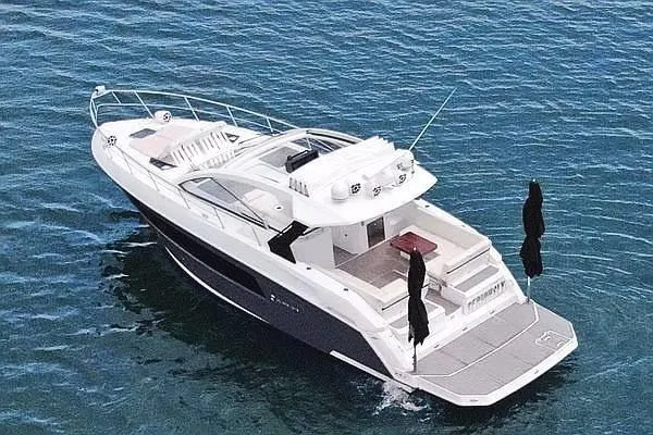Slide: The Image of 2018 Cruisers Yachts 390 Express Coupe on calm blue water, aerial view. - 8
