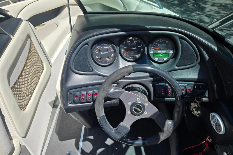 Slide: The Image of 2003 Malibu Sunscape 21 LSV dashboard with steering wheel and instrument panel. - 11
