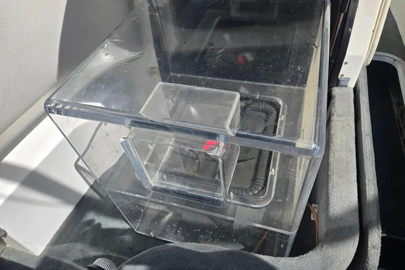 Slide: The Image of Clear acrylic box inside a 2003 Malibu Sunscape 21 LSV boat interior. - 19
