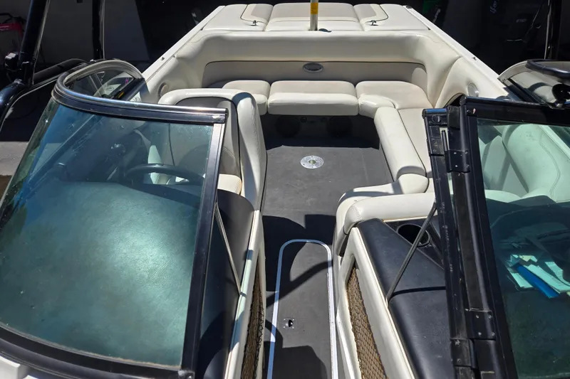 Slide: The Image of 2003 Malibu Sunscape 21 LSV boat interior with white seating and windshield. - 5