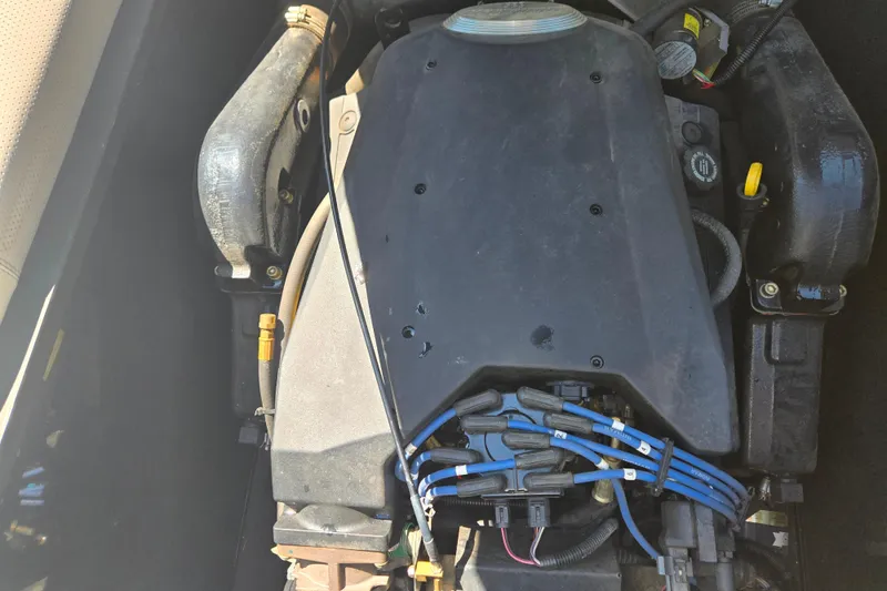 Slide: The Image of Engine compartment of a 2003 Malibu Sunscape 21 LSV boat, showing wiring and components. - 7