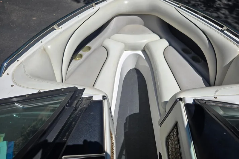 Slide: The Image of Interior view of a 2003 Malibu Sunscape 21 LSV boat with white seating. - 9
