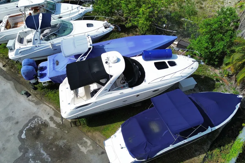 Slide: The Image of Aerial view of a 2003 Monterey 302 Cruiser docked among other boats. - 12