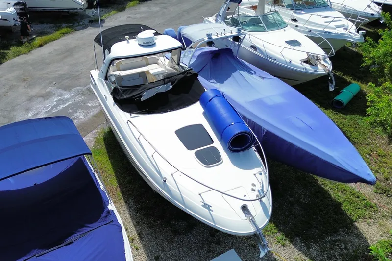 Slide: The Image of 2003 Monterey 302 Cruiser boat docked with cover and accessories. - 14