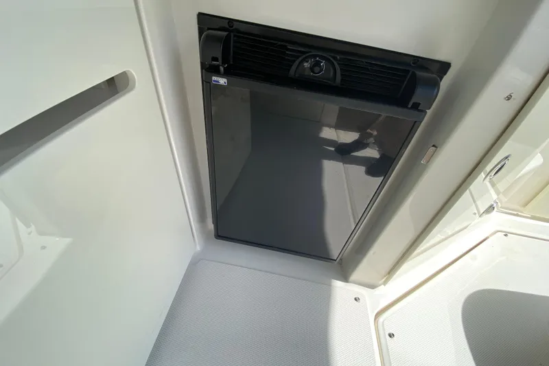 Slide: The Image of Compact refrigerator in 2003 Monterey 302 Cruiser boat interior. - 33