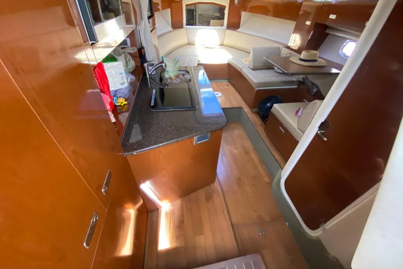 Slide: The Image of Interior of a 2003 Monterey 302 Cruiser with wood finish and cozy seating area. - 42