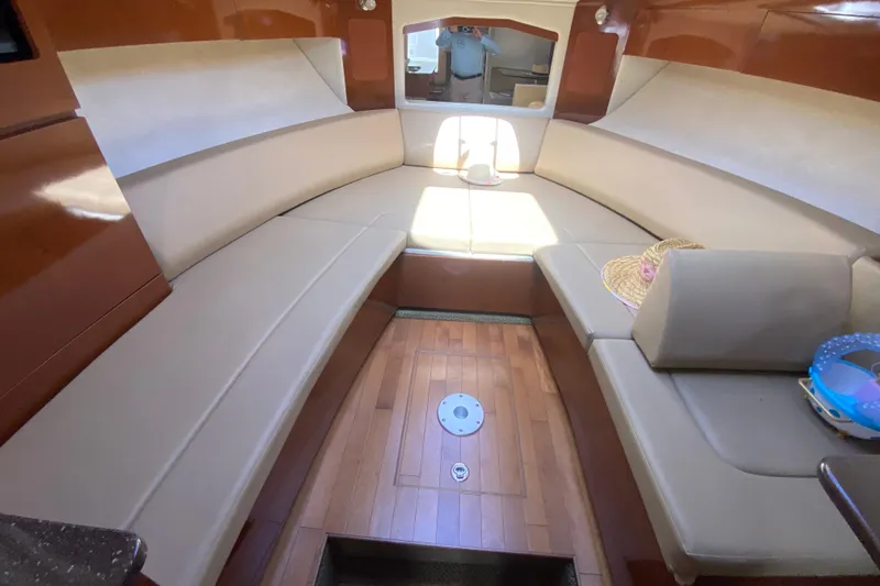 Slide: The Image of Interior of 2003 Monterey 302 Cruiser with beige seating and wooden flooring. - 44
