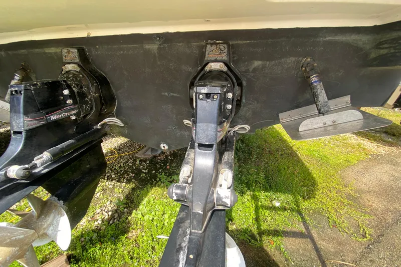 Slide: The Image of Rear view of a 2003 Monterey 302 Cruiser boat with MerCruiser outdrives. - 55
