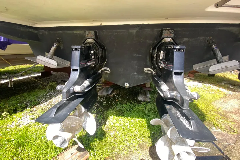 Slide: The Image of Rear view of a 2003 Monterey 302 Cruiser with dual propellers and outdrives. - 57