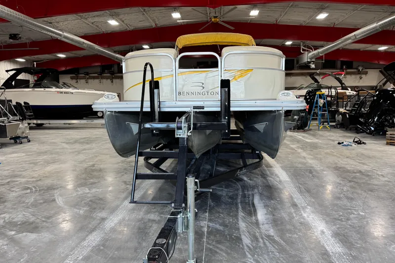 Slide: The Image of 2005 Bennington 2575 RL pontoon boat on trailer in indoor showroom. - 6