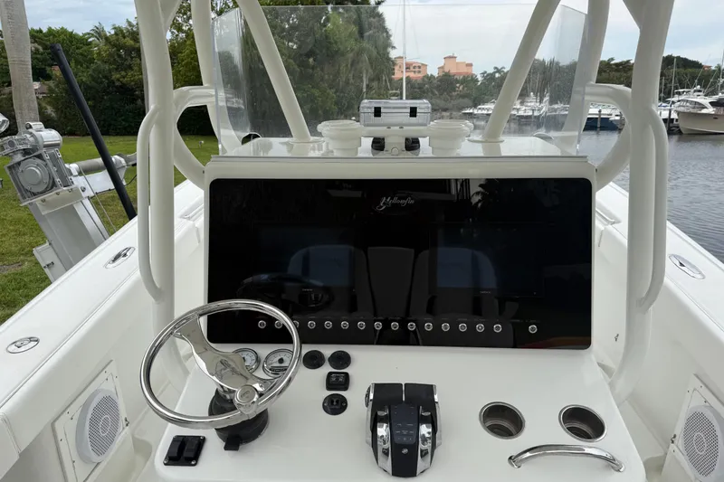 Slide: The Image of 2006 Yellowfin 34 Offshore boat console with steering wheel and controls. - 36