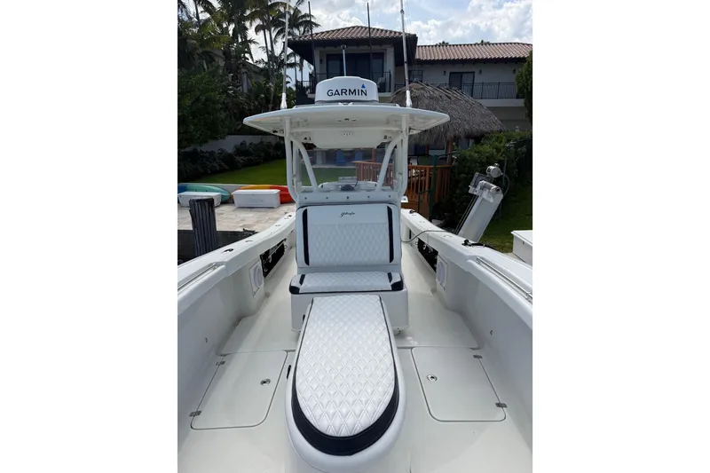 Slide: The Image of 2006 Yellowfin 34 Offshore boat with Garmin equipment, docked near a house. - 40