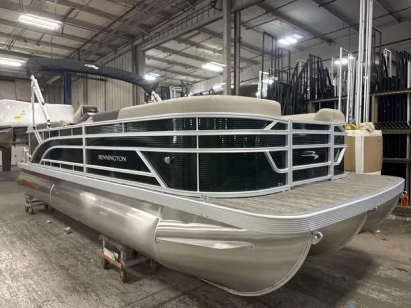 The Image of 2026 Bennington 23 SSR pontoon boat in warehouse. - 1