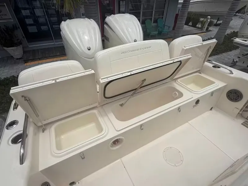 Slide: The Image of 2026 Grady-White 281 Coastal Explorer with open storage compartments. - 3