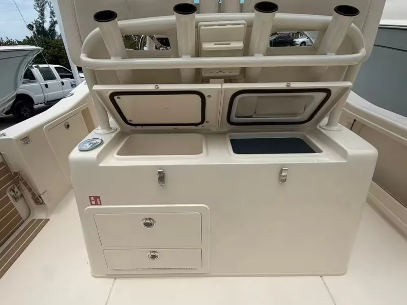 Slide: The Image of 2026 Grady-White 281 Coastal Explorer with storage and fishing rod holders. - 4