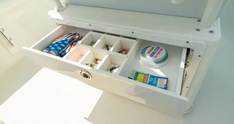 Slide: The Image of Pathfinder 2400 TRS 2026 boat drawer with fishing gear. - 12