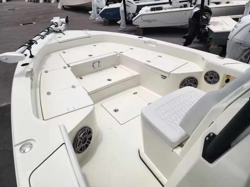 Slide: The Image of Interior of 2026 Pathfinder 2800 Hybrid boat, white design with speakers. - 10