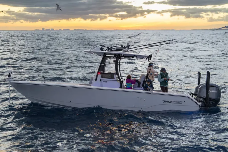 Slide: The Image of Pathfinder 2800 Hybrid 2026 fishing at sunset on the ocean. - 3