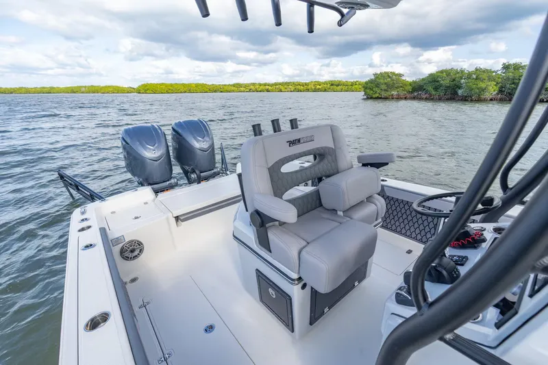 Slide: The Image of Pathfinder 2800 Hybrid 2026 boat on calm water with dual engines. - 10