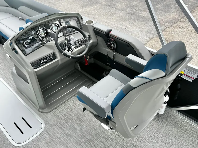 Slide: The Image of Interior of Avalon LSZ 23' Cruise Triple-Toon 2026, helm console and seat. - 21